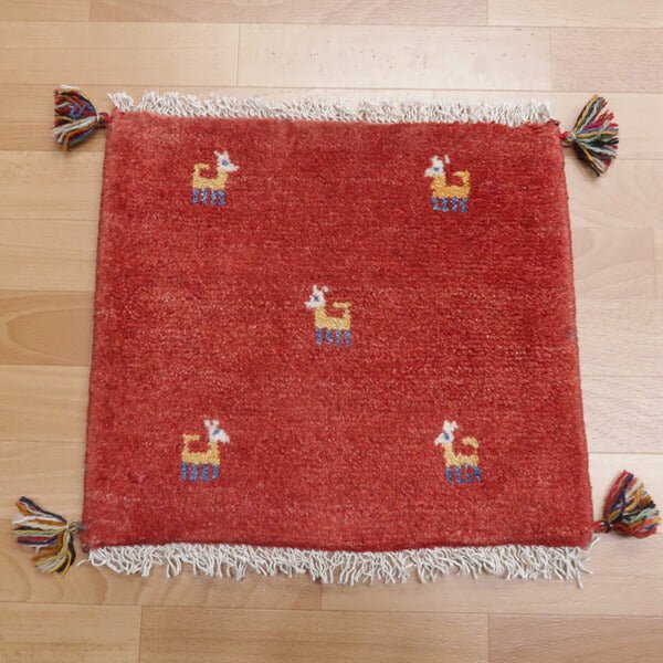 Rug with animal motifs in red — shown on the floor (HP-32902)