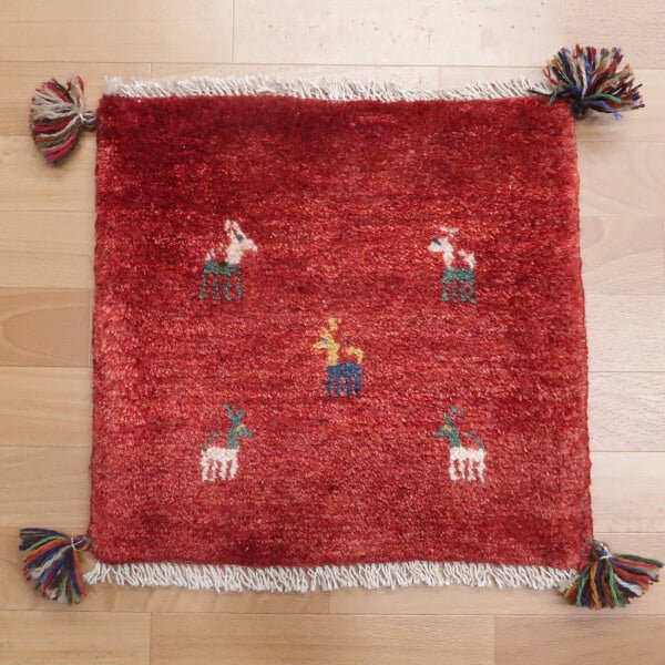 Rug with animal motifs in red — shown on the floor (HP-35404)
