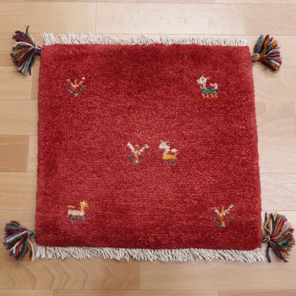 Rug with animal motifs in red — shown on the floor (HP-35432)
