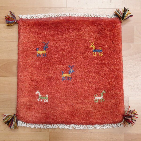 Rug with animal motifs in red — shown on the floor (HP-35489)