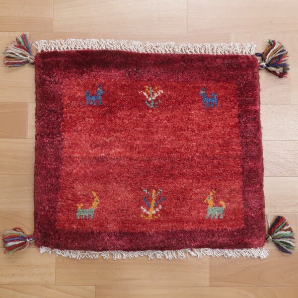 Rug with animal motifs in red — shown on the floor (HP-36716)