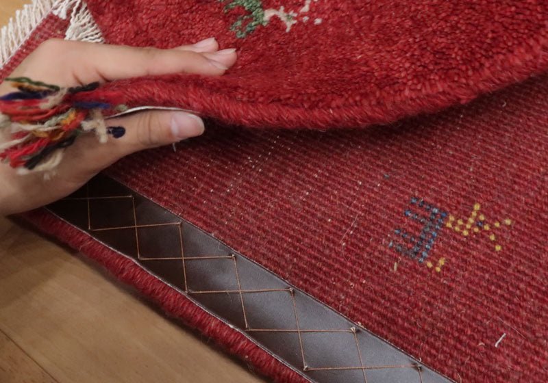 Rug in red tones — reverse view