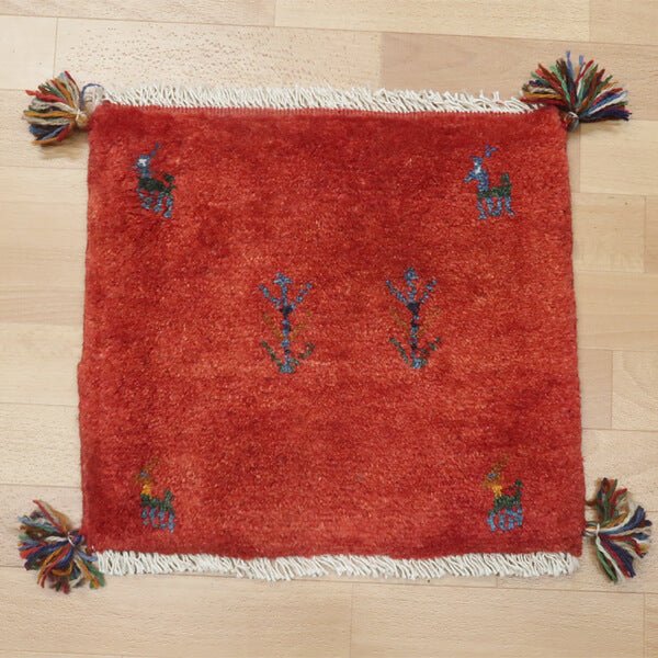 Rug with animal motifs in red — shown on the floor (HP-36877)