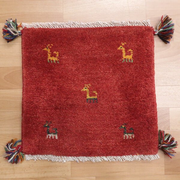 Rug with animal motifs in red — shown on the floor (HP-36910)
