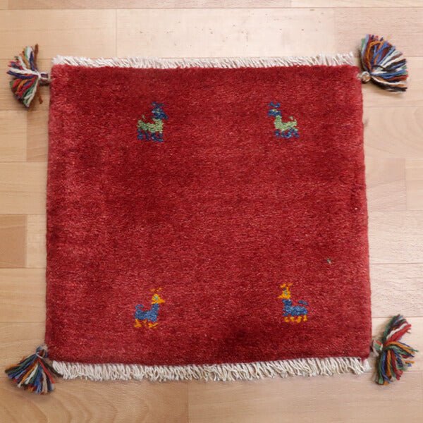 Rug with animal motifs in red — shown on the floor (HP-36920)
