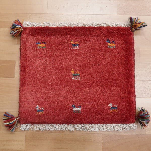 Rug with animal motifs in red — shown on the floor (HP-36922)