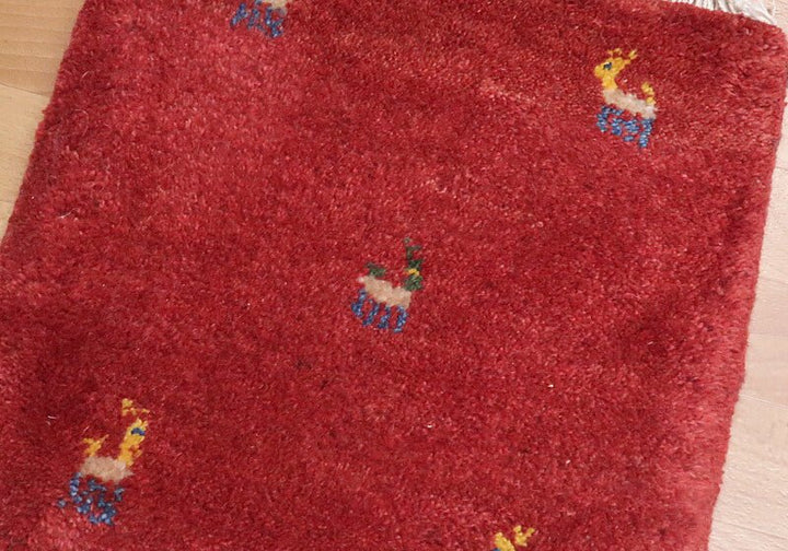 Rug in red tones — shown on the floor